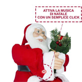 Père Noël assis sur la chaise 90cm 144059 avec sac cadeaux et sons de décoration