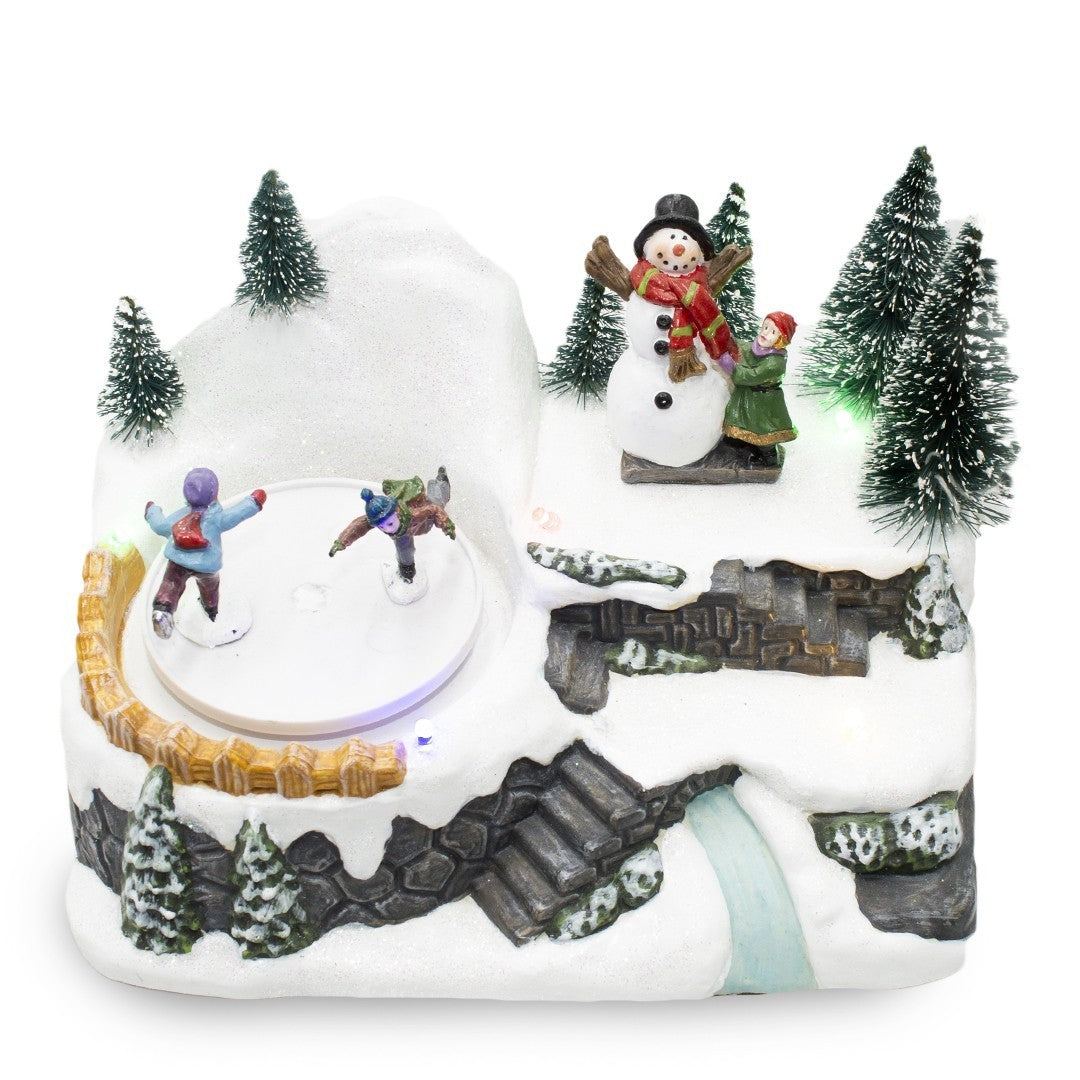 361004 Carrousel village Noël avec piste lumineuse mouvement musical 18x13x16cm