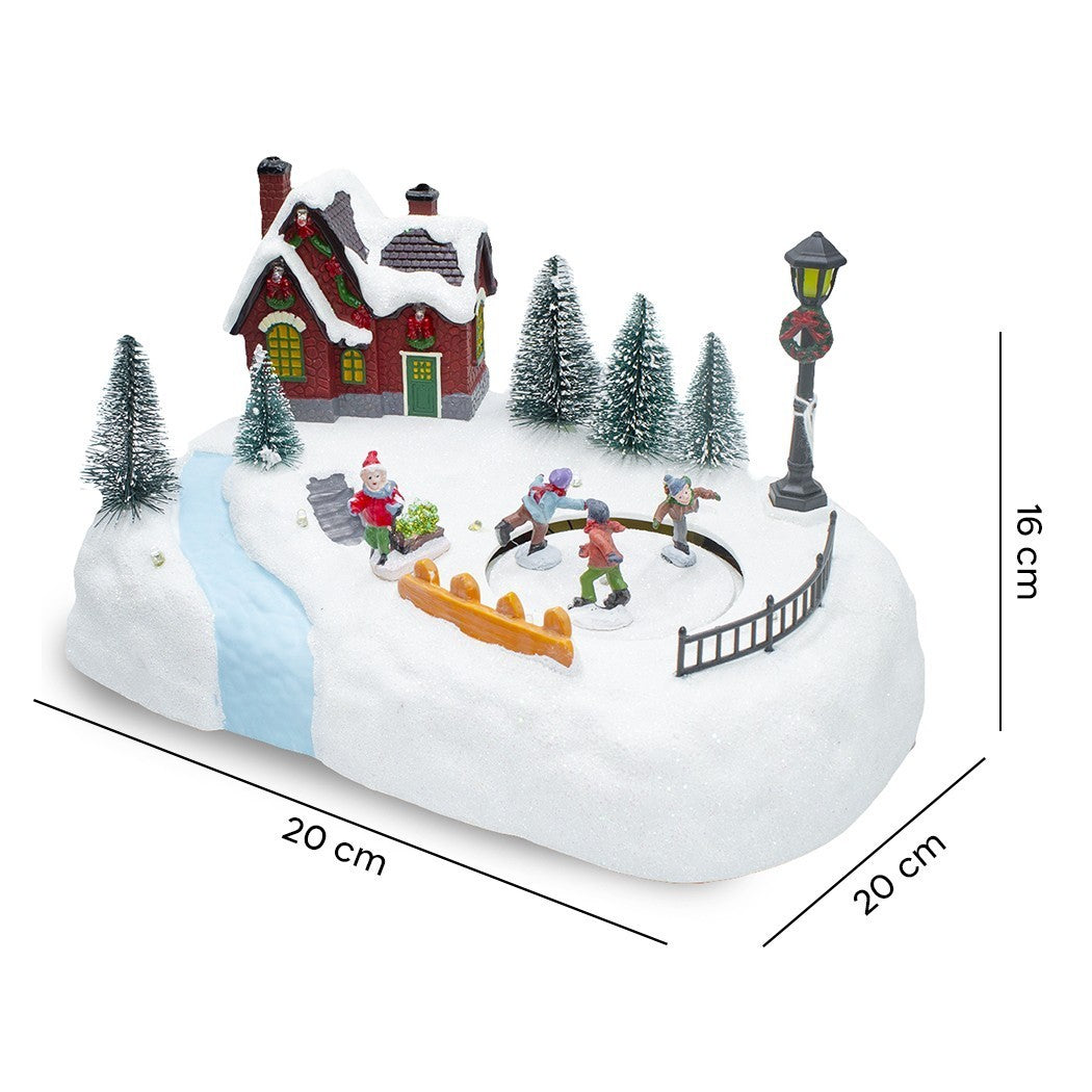 361040 Carrousel de Noël patinoire avec lumières, sons et mouvements 20x20x16 cm